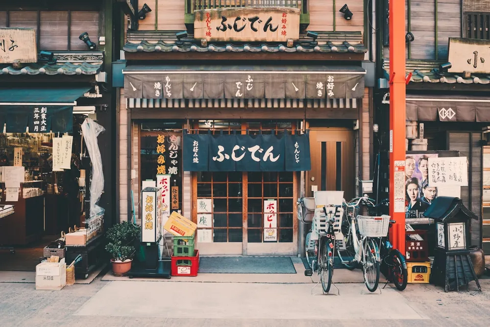A traditional Japanese shopfront with bicycles outside