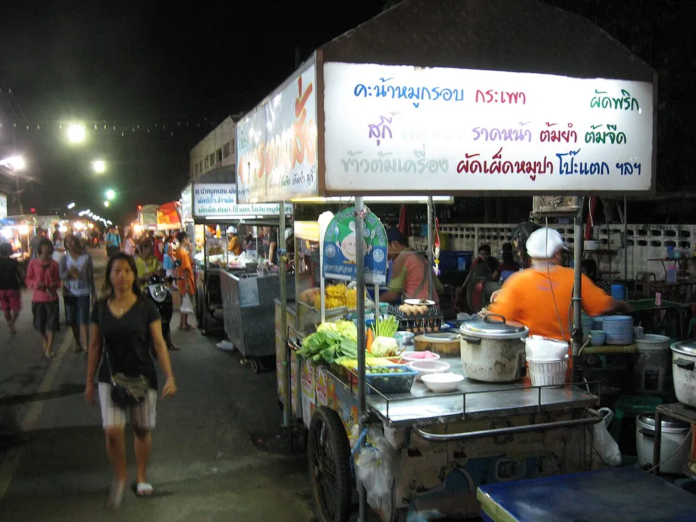 A street food cart at a Thai night market