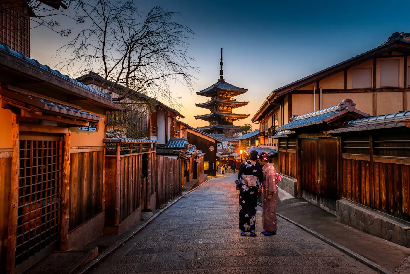 A Kyoto lane at dusk with the Yasaka pagoda beyond