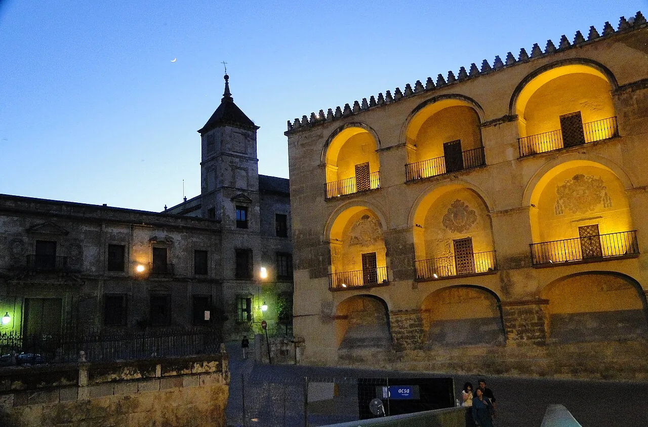 The Mezquita of Córdoba lit at night, seen from the Puente Romano