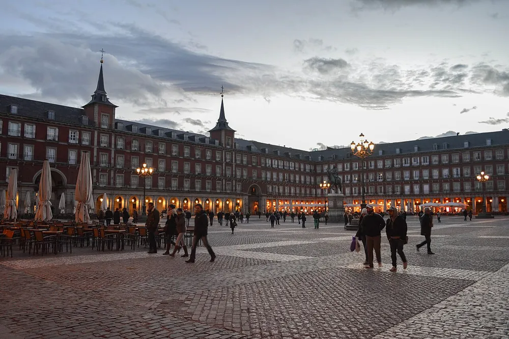 The Plaza Mayor at dusk, arcaded on all four sides