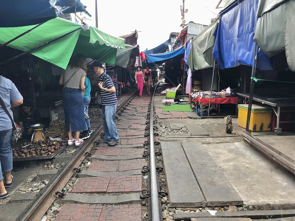 Market stalls pitched along the live railway track at Mae Klong